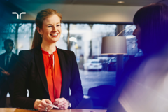 woman at desk speaking to a customer