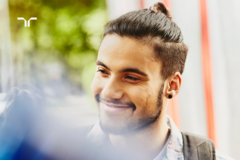 smiling man looking off camera