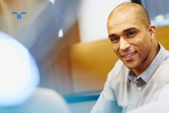 smiling man looking off camera