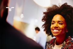 woman smiling towards a person mostly off-camera