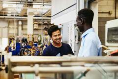 two people working in a factory