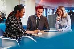 three people in a meeting