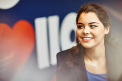 woman smiling at his desk