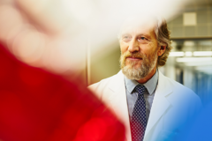 older male in a medical uniform