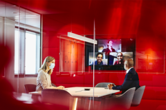 people working in an office boardroom