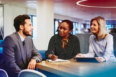 three people talking