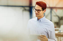 man with glasses smiling