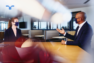 two people talking with mask