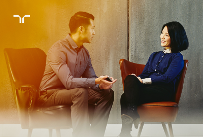 two people having a conversation while sitting