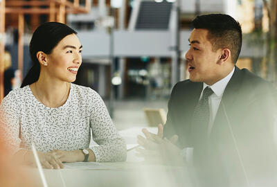 man and woman talking