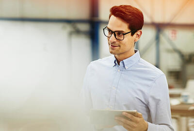 man with glasses smiling