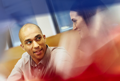 two colleagues talking in the office