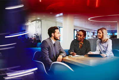 two colleagues talking in the office