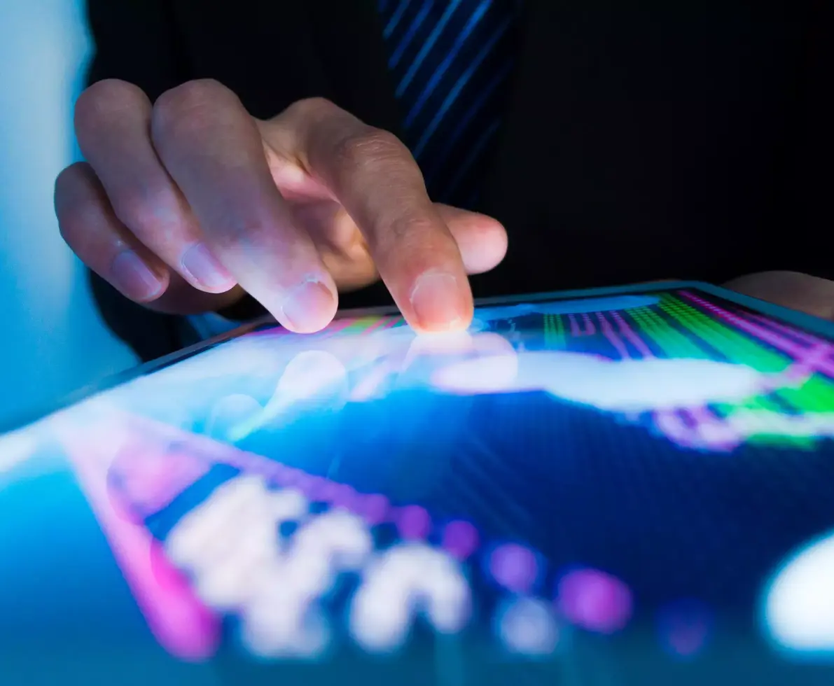 Market analyze with digital moniter focus on tip of finger