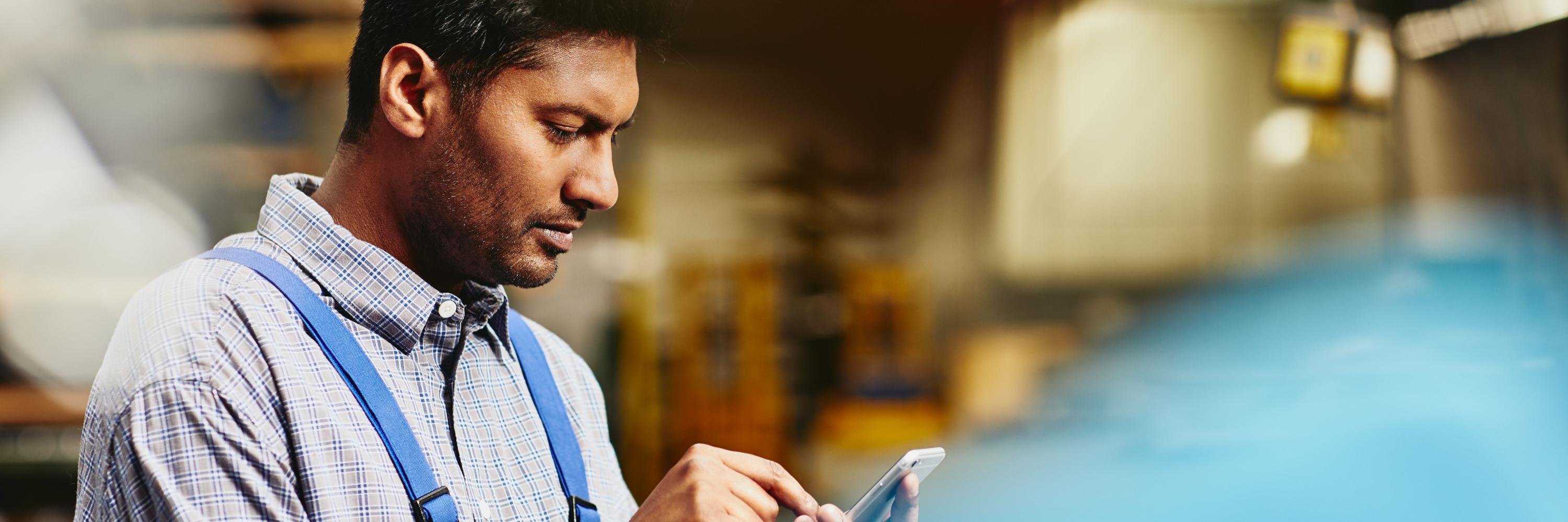 indian man on a tablet